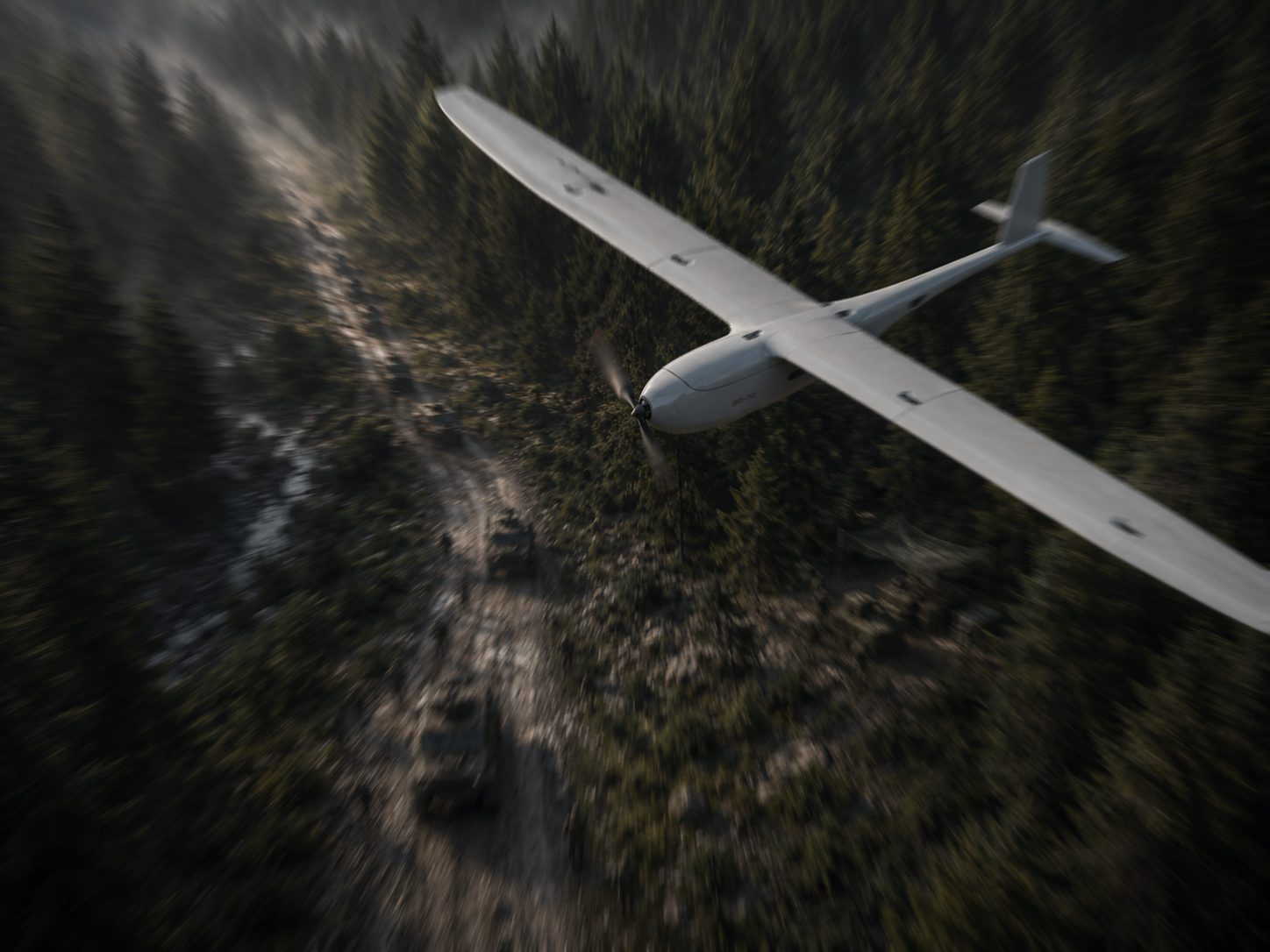 Operator preparing fixed-wing UAV for launch